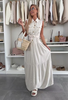 Robe chemise sans manches boutonnées à volants avec ceinture de couleur beige.

Les pépites de Christelle